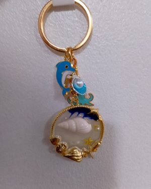 LLAVERO DE MAR CON CONCHAS Y DELFIN AZUL $145