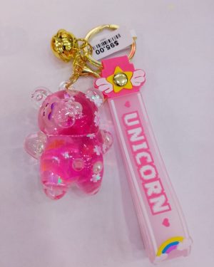 LLAVERO DE OSITO ROSA DE CRISTAL CON FLORES DENTRO $95