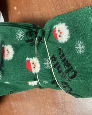 CALCETINES VERDES CON CABEZAS DE SANTA CLAUS $45