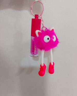 LIP GLOSS CON LLAVERO DE BOLITA PELUDA CON GORRO Y LENTES ROMANTIC RAIN$95